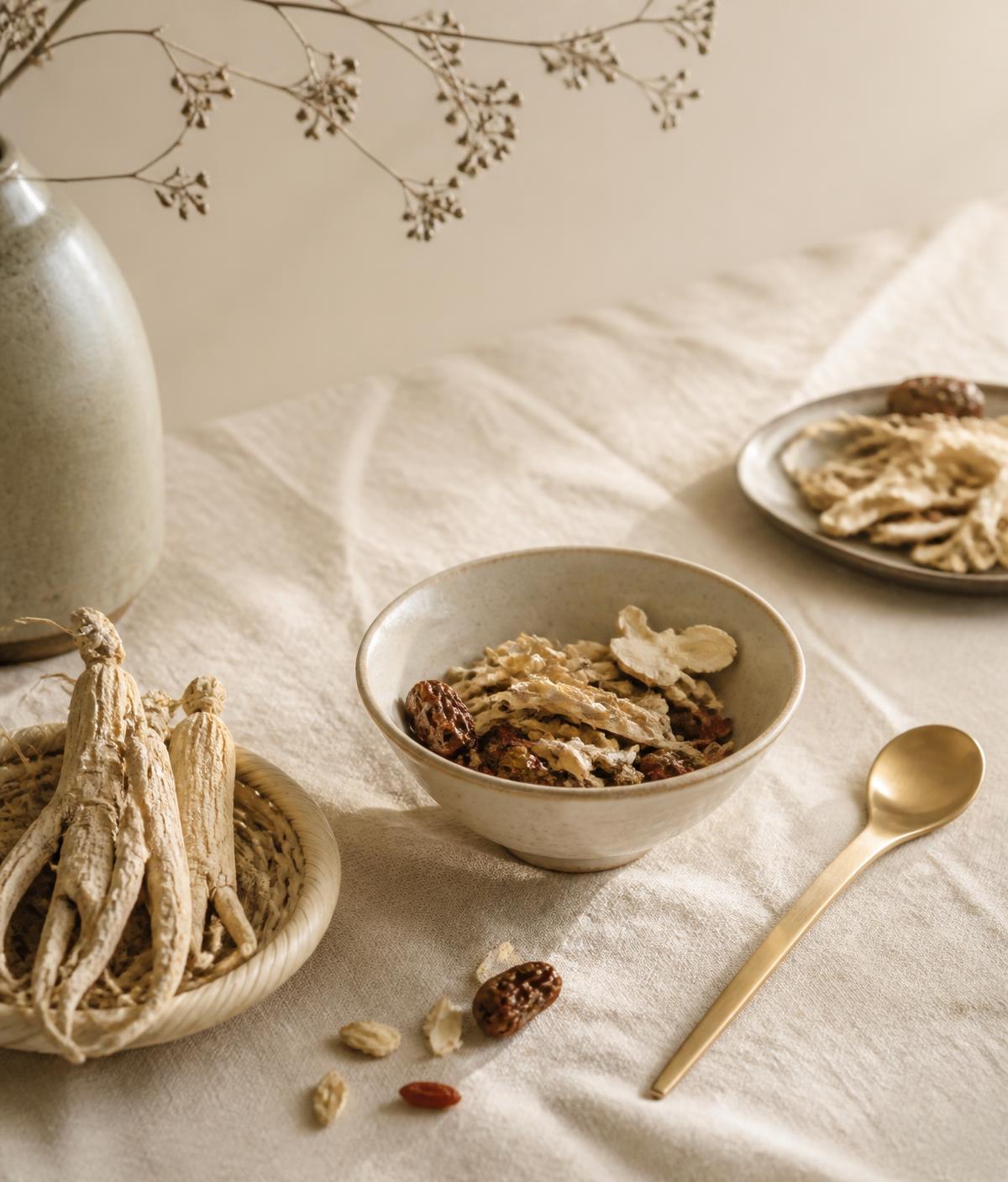 Dried herbs and porcelain arranged in soft daylight